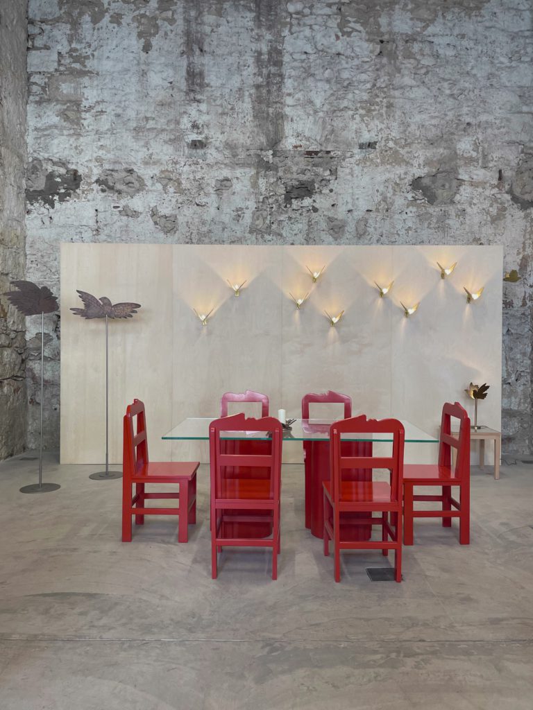 Red Chairs Against Stone
